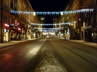 Glimmering empty street in the middle of the night