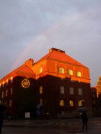 KTH under red dusk light and a rainbow